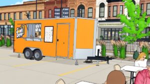 Soda Drop trailer at Bismarck Depot event site with a cartoon overlay.