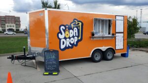 Soda Drop food trailer parked outside at an event.